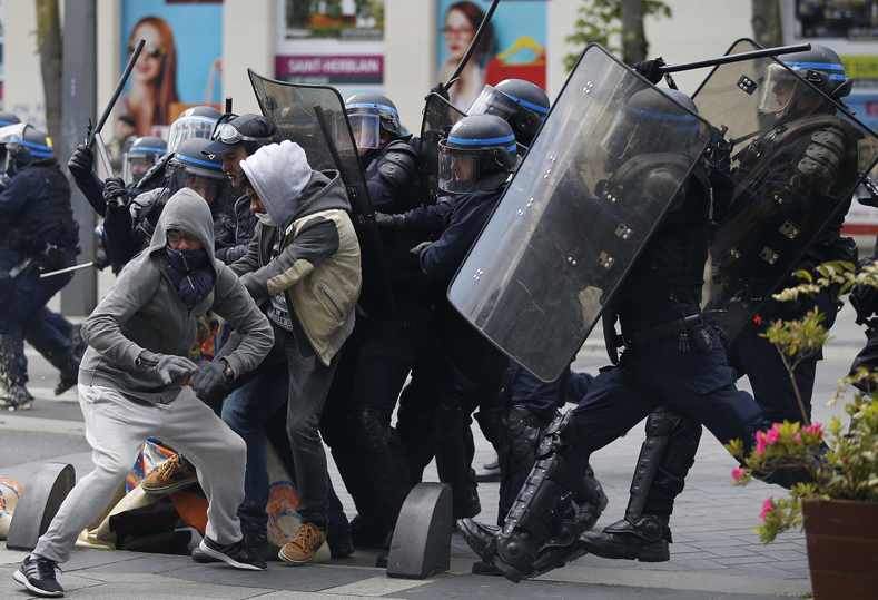 French riot police officers clash with protestors during a demonstration against the French labour law proposal in Nantes, France, as part of a nationwide labor reform protests and strikes. 