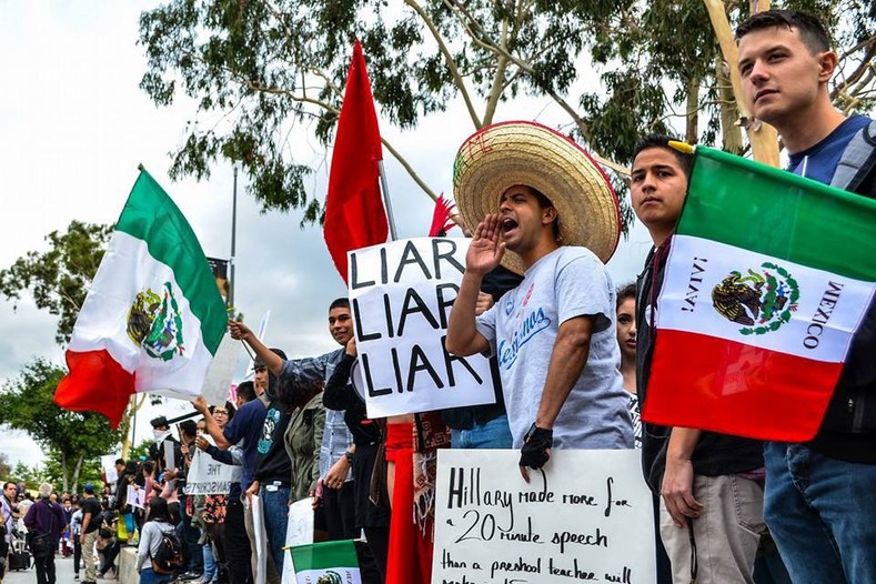 Los Angeles residents protest Hillary Clinton's visit to East Los Angeles College, May 5, 2016.