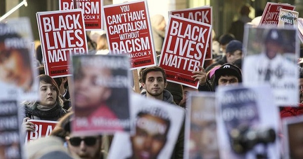Black Lives Matter protesters gather in Westlake Park near Westlake Mall during Black Friday in Seattle, Washington.