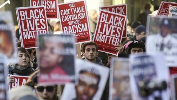 Black Lives Matter protesters gather in Westlake Park near Westlake Mall during Black Friday in Seattle, Washington.