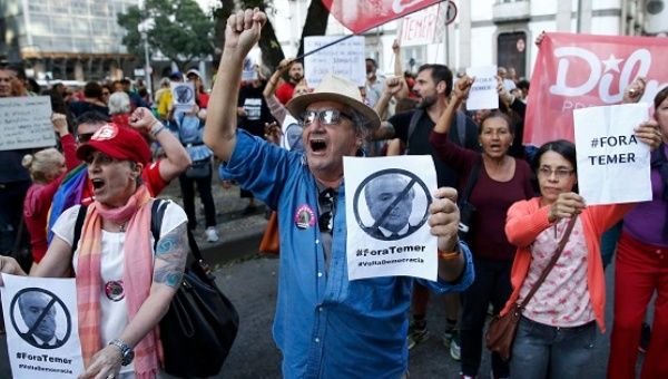 Protesters take part in a demonstration against interim President Michel Temer in the centre of Rio de Janeiro, Brazil, July 31, 2016.