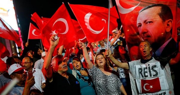 People shout slogans and wave Turkish national flags as they have gathered in solidarity night after night since the July 15 coup attempt in central Ankara, Turkey, July 27, 2016.