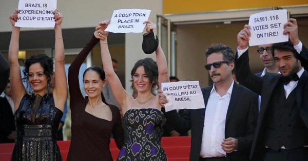 Director Kleber Mendonca (2nd R) and cast members protest the 