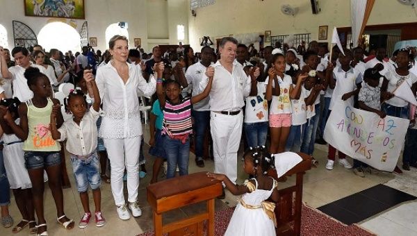 Nobel Peace Prize winner Colombia's President Juan Manuel Santos participates in a mass in the town of Bojaya, Colombia, Oct. 9, 2016.
