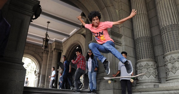 A young man performs a skateboard trick ahead of a protest demanding more recreational activities for youth, Guatemala City, June 27, 2013.