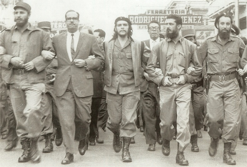 Fidel Castro (L) and Che Guevara (C) lead a memorial march in Havana May 5, 1960, for the victims of the La Coubre freight ship explosion, considered to be one of the first CIA attempts to undermine the Cuban revolution.