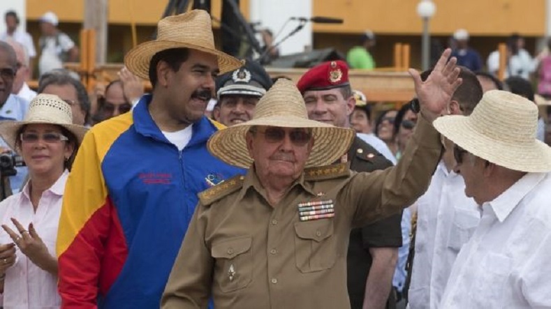 Venezuelan President Nicolas Maduro (2ndL) stands next to Raul Castro (C). Maduro sent a message of solidarity and support to the Cuban government and population.