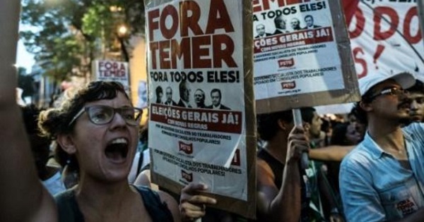 Activist protest against Brazil's unelected President Michel Temer and his neoliberal policies in Rio de Janeiro, Oct. 17, 2016.
