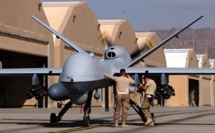 U.S. airmen prepare a U.S. Air Force MQ-9 Reaper drone as it leaves on a mission at Kandahar Air Field, Afghanistan, March 9, 2016. 