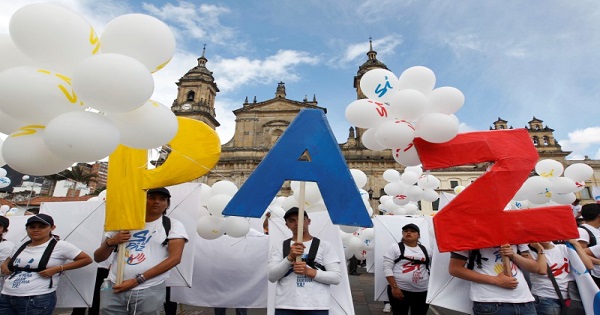People form the word Peace with letters at the Bolivar square outside the cathedral in Bogota, Colombia, September 26, 2016.