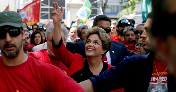 Former Brazilian President Dilma Rousseff is saluted by people after giving her speech in a rally organised by Uruguay's workers union PIT-CNT in Montevideo, Uruguay November 4, 2016.