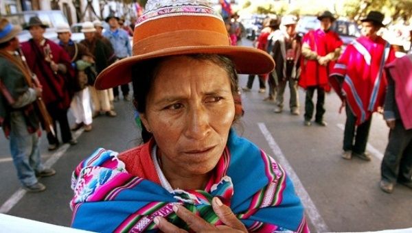 An Indigenous woman joins a demonstration calling for the protection of Mother Earth in Bolivia.