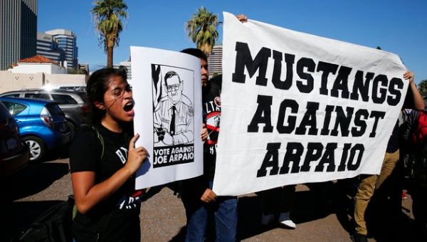 High school sophomore Yazmin Sagastume protests against Sheriff Joe Arpaio on Election Day in downtown Phoenix, AZ