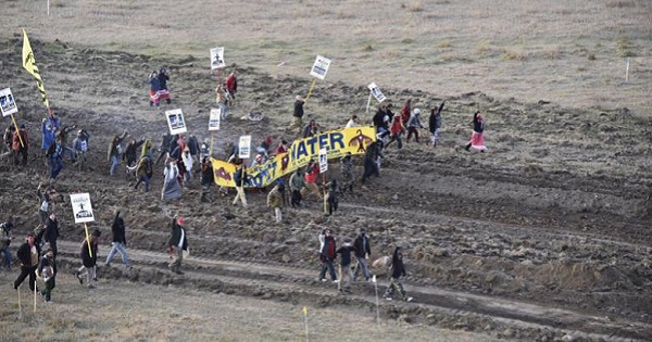 Protesters gather near a pipeline being built by a group of companies led by Energy Transfer Partners LP at a construction site in North Dakota before being confronted by police.