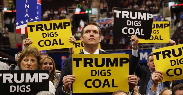 Delegates from West Virginia hold signs supporting coal on the second day of the Republican National Convention in Cleveland, Ohio.