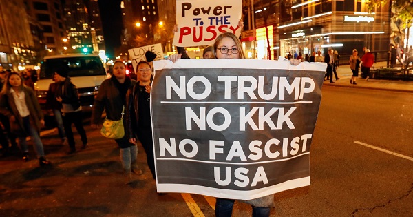 Protesters walk during a protest against Republican President-elect Donald Trump in Chicago, Illinois, Nov. 9, 2016.