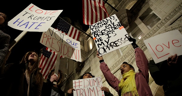 Demonstrators protest against U.S. President-elect Donald Trump in front of the Trump International Hotel in Washington, D.C., Nov. 10, 2016.