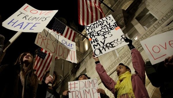 Demonstrators protest against U.S. President-elect Donald Trump in front of the Trump International Hotel in Washington, D.C., Nov. 10, 2016.