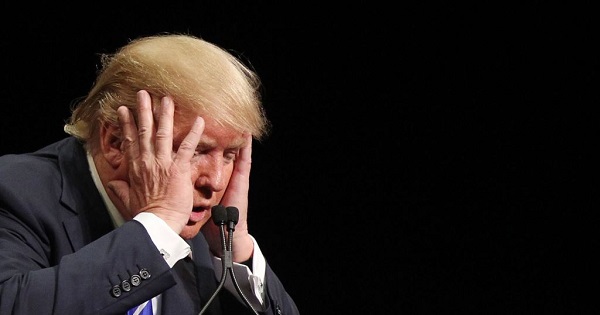 U.S. President-elect Donald Trump reacts during a speech.