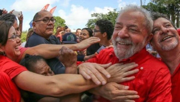 Former Brazilian President Lula da Silva is mobbed by supporters in an undated archive image.
