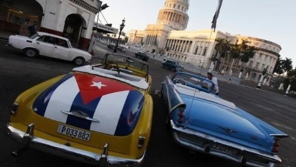 Cars parked outside El Capitolio, Havana, Cuba. 