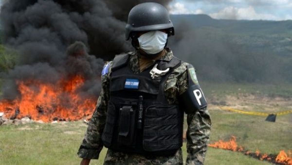 Anti-narcotics and military police officers incinerate more than 200 kilos of cocaine seized in southern Honduras, on the outskirts of Tegucigalpa, Aug. 5, 2016.