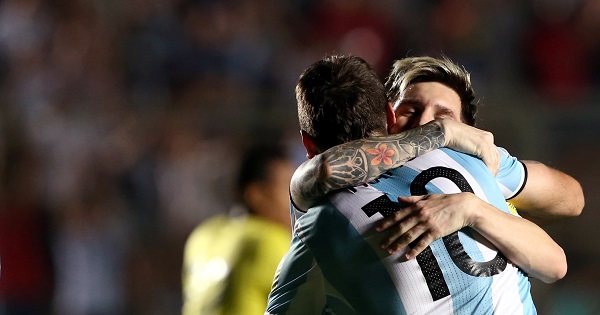 Argentina's Lucas Pratto (C) is embraced by Lionel Messi after he scored his team's second goal.