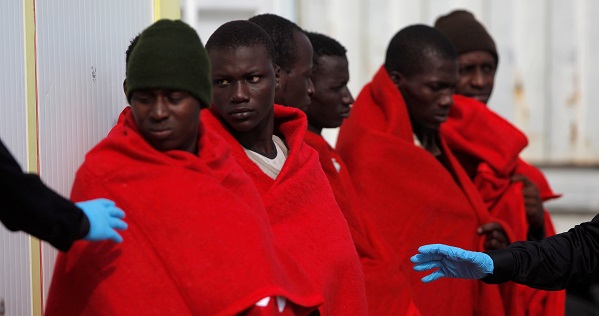 Migrants, who are part of a group intercepted aboard a dinghy off the coast in the Mediterranean Sea, arrive on a rescue boat in Malaga, Spain.