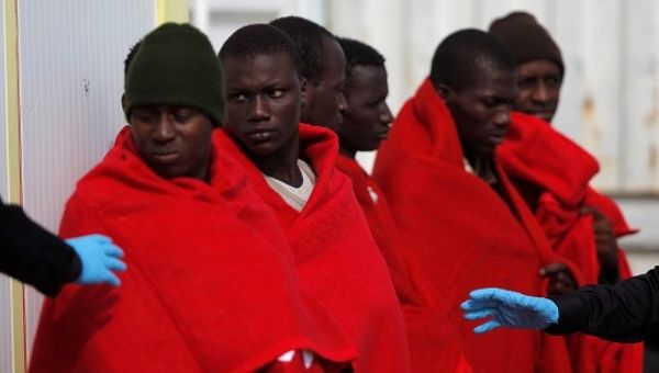 Migrants, who are part of a group intercepted aboard a dinghy off the coast in the Mediterranean Sea, arrive on a rescue boat in Malaga, Spain.