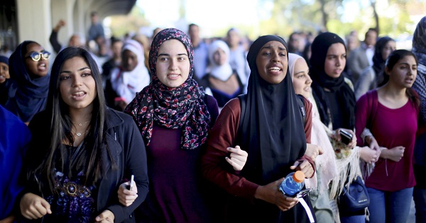 Students chant while marching at a rally against Islamophobia at San Diego State University.