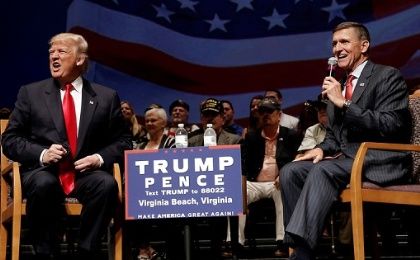 President-elect Donald Trump and retired General Michael Flynn speak at an event.