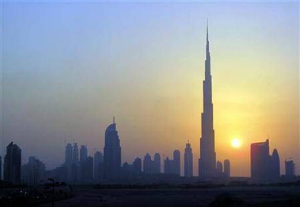 The Burj Khalifa skyscraper is seen as the sun sets over Dubai.