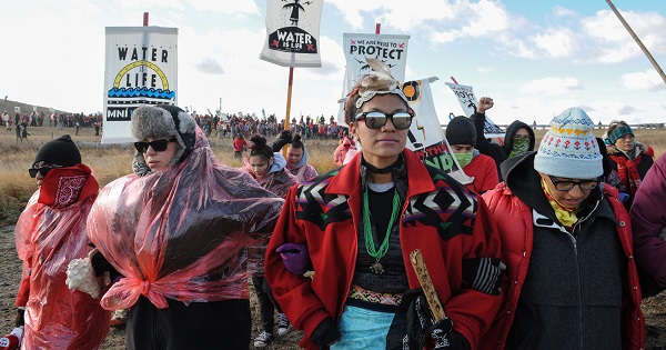 Demonstrators march against the Dakota Access pipeline near the Standing Rock Indian Reservation, near Cannon Ball, North Dakota, Nov. 18, 2016.