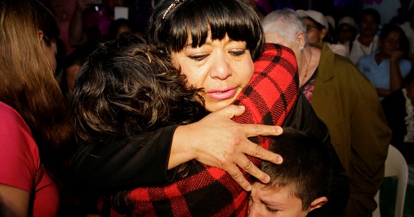 Maria Aida and her sister Norma Janet embrace upon reuniting after 32 years in the state of Veracruz, Nov. 19, 2016.
