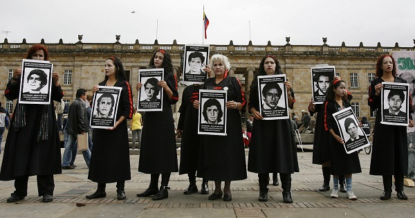 A group of women take part in a demonstration against enforced disappearance and in support of the victims in the Plaza Bolivar, Bogota, Colombia, May 29, 2009.