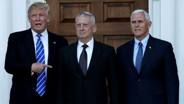 Donald Trump and Mike Pence greet retired General James Mattis (C) in Bedminster, New Jersey, U.S., Nov. 19, 2016. 