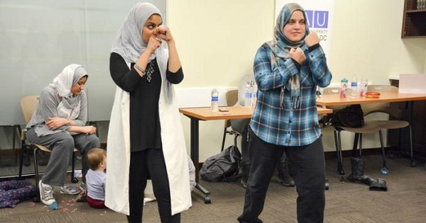 Egyptian-American community activist Rana Abdelhamid (L) demonstrates a move during a self-defense workshop, in Washington, DC.