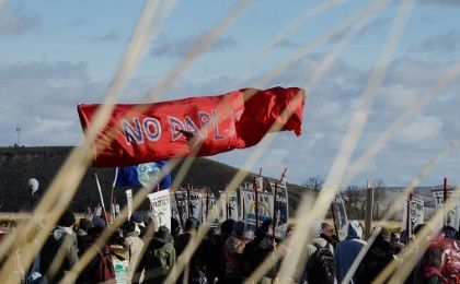 A banner is flown during a protest against plans to pass the Dakota Access pipeline near the Standing Rock Indian Reservation, North Dakota, U.S., Nov. 18, 2016.