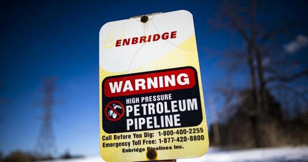 An Enbridge sign warning of a high pressure petroleum pipeline is seen on route.