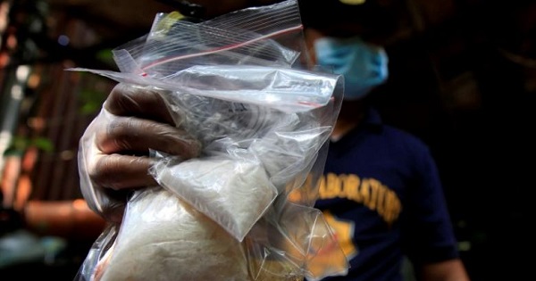 A member of the Philippine National Police shows methamphetamine, known locally as Shabu, Quiapo city, metro Manila, Philippines July 3. 2016.