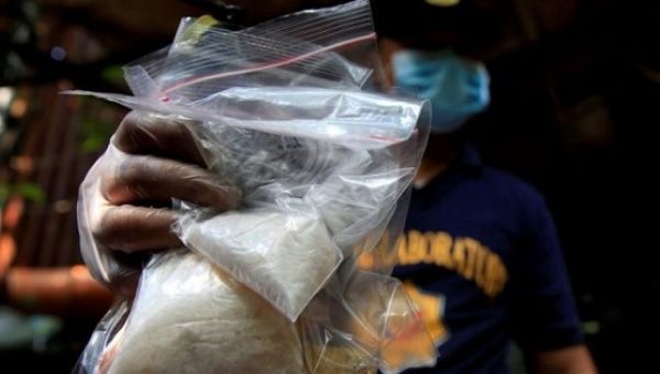 A member of the Philippine National Police shows methamphetamine, known locally as Shabu, Quiapo city, metro Manila, Philippines July 3. 2016. 