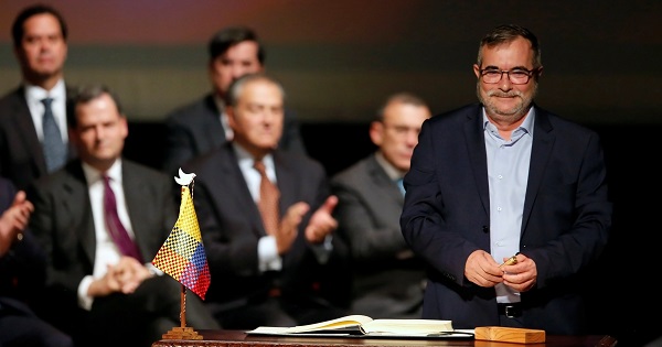 Colombia's FARC leader Rodrigo Londono, known as Timochenko, signs a new peace accord in Bogota, Colombia Nov. 24, 2016.