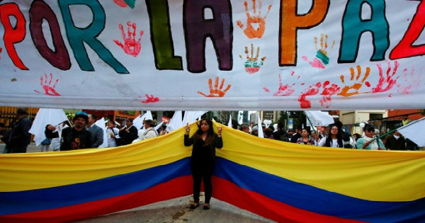 Supporters rallying for the nation’s new peace agreement during a march in Bogota, Colombia