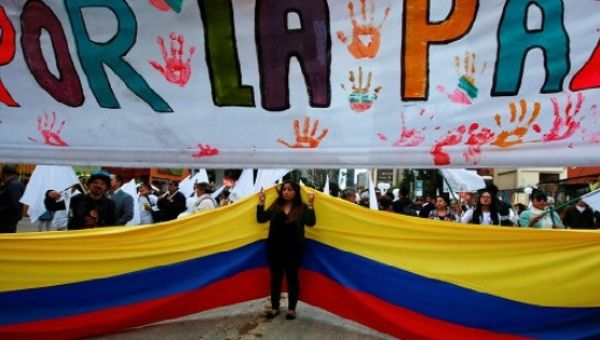 Supporters rallying for the nation’s new peace agreement during a march in Bogota, Colombia
