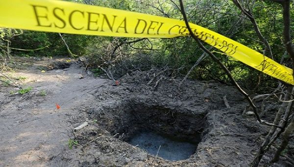 Clandestine graves are seen at Pueblo Viejo, in the outskirts of Iguala, Oct. 7, 2014.