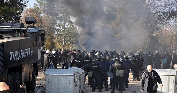 Bulgarian riot police are seen inside a refugee camp during clashes with migrants in the town of Harmanli, Bulgaria, Nov. 24, 2016.