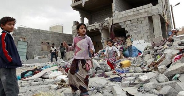 Children Stand on a bombe dbuilding in Yemen