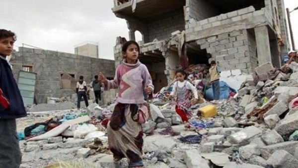 Children Stand on a bombe dbuilding in Yemen