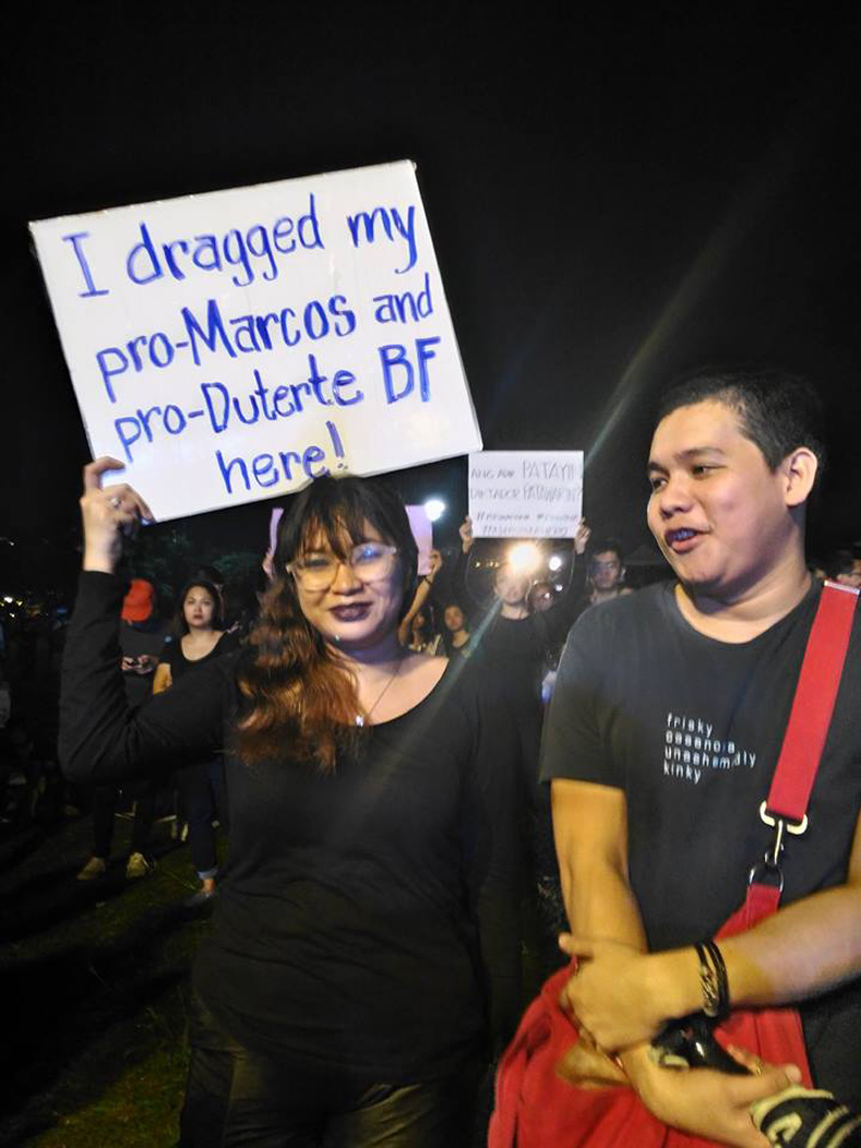 A protester holds a placard during a protest at Luneta Park, Metro Manila, Philippines, Nov. 25, 2016.