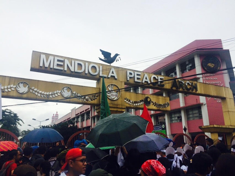 At the peak, about 10,000 rallied in the capital's Rizal Park on Friday, many under umbrellas following an afternoon of rain. They held banners and placards saying 
